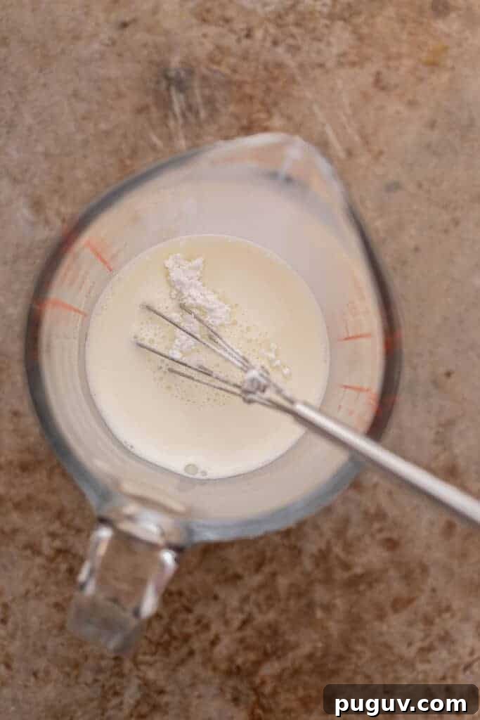 Chick-fil-A Mocha Cream Cold Brew: Homemade Copycat Recipe 5 Whisking sweet cream mixture in measuring cup