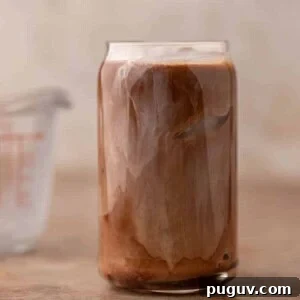 Chick-fil-A Mocha Cream Cold Brew: Homemade Copycat Recipe 9 Sweet cream mixing into iced mocha coffee