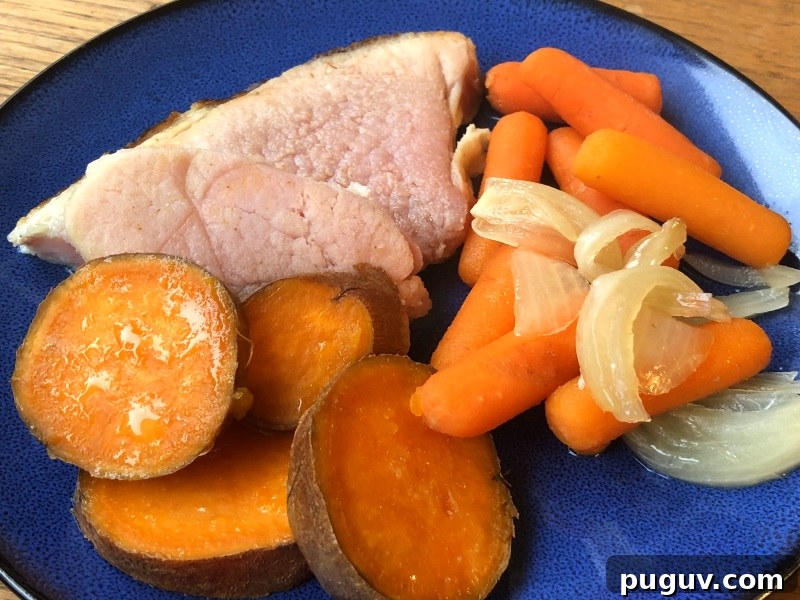 Slow-Cooker Ham Dinner Ideas for Weeknight Meals 2 Crockpot Ham Supper with carrots, sweet potatoes and onions on blue plate from ApronFreeCooking