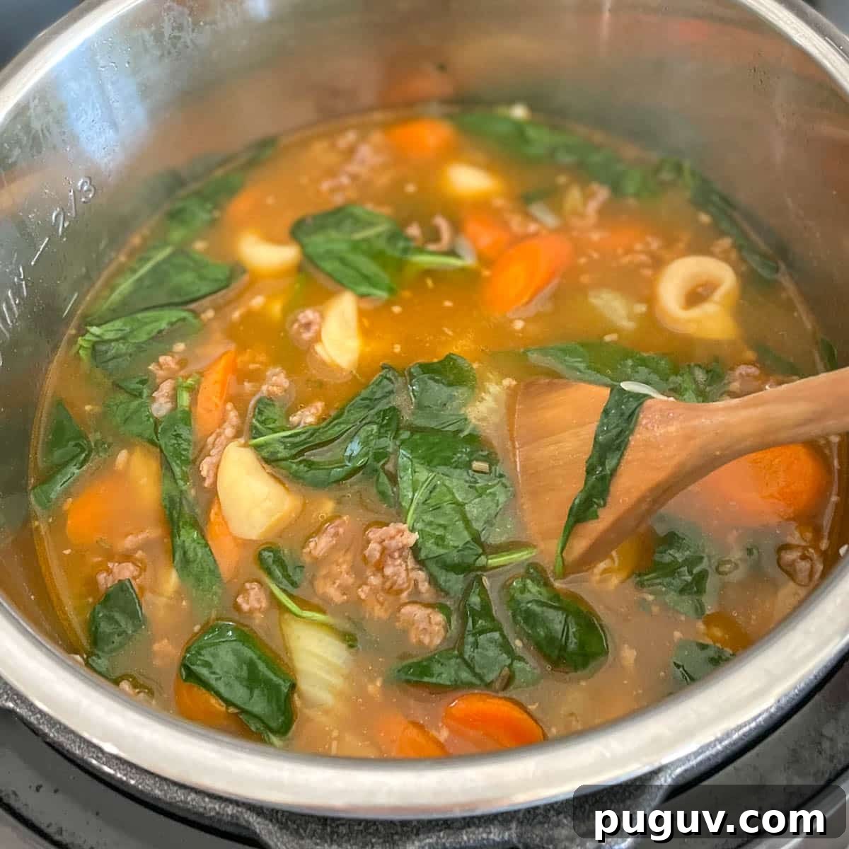 Creamy Instant Pot Tortellini Soup Recipe for Quick Weeknights 9 Spinach is added to soup.
