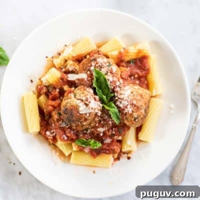 Gluten free turkey meatballs served on pasta.