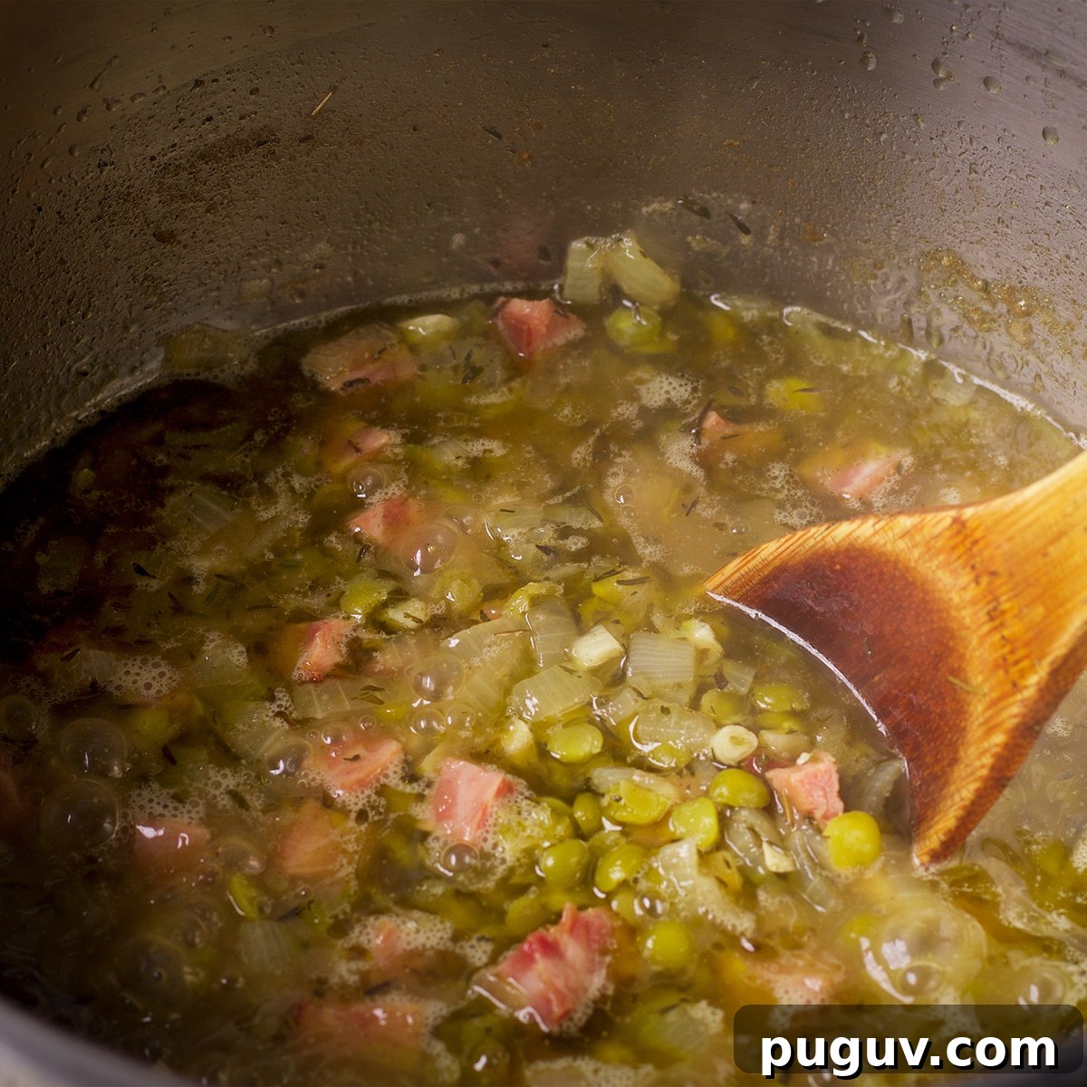 Truffled Fried Potatoes with Creamy Split Pea Soup 4 Using a wood spoon to stir a pot of split pea soup while it cooks.