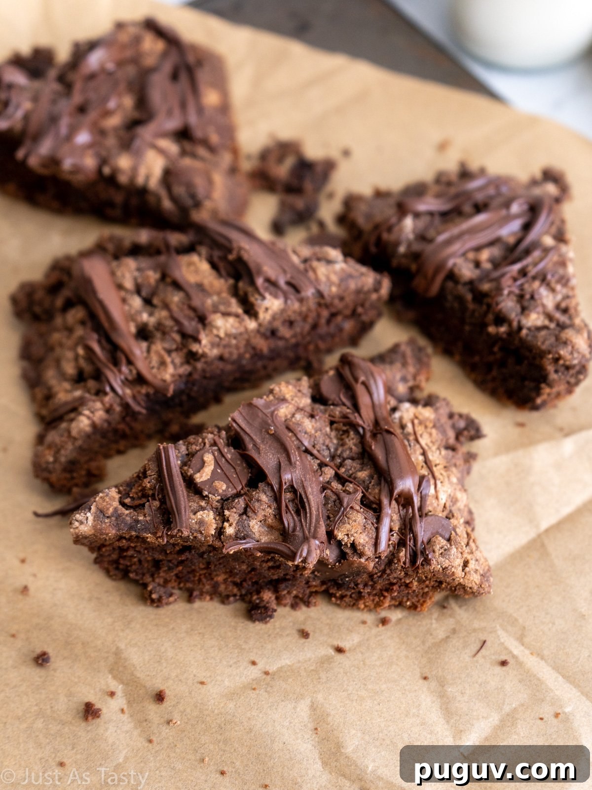 Triple Chocolate Gluten-Free Eggless Scones Recipe 2 Close-up of chocolate scones on parchment paper.