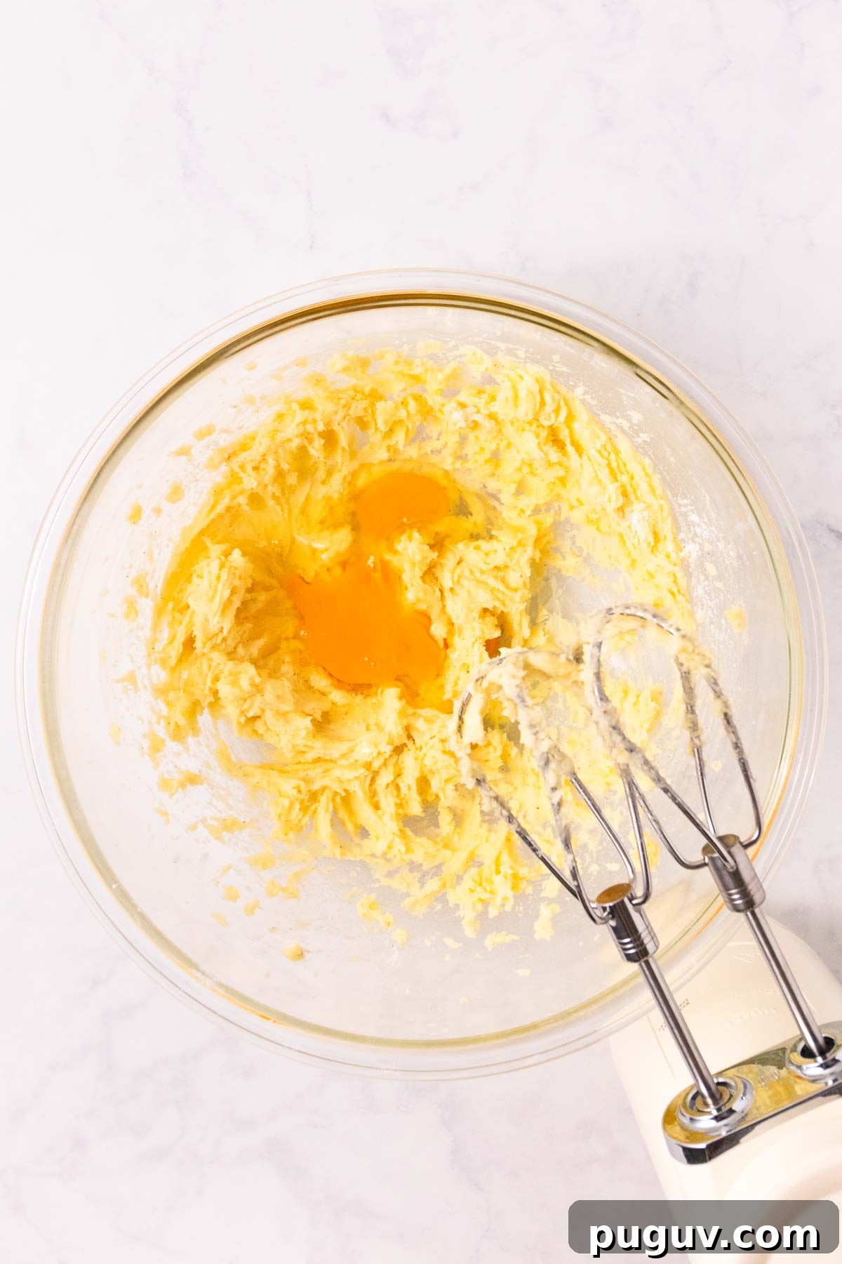 Creamed butter and sugar with egg in a bowl