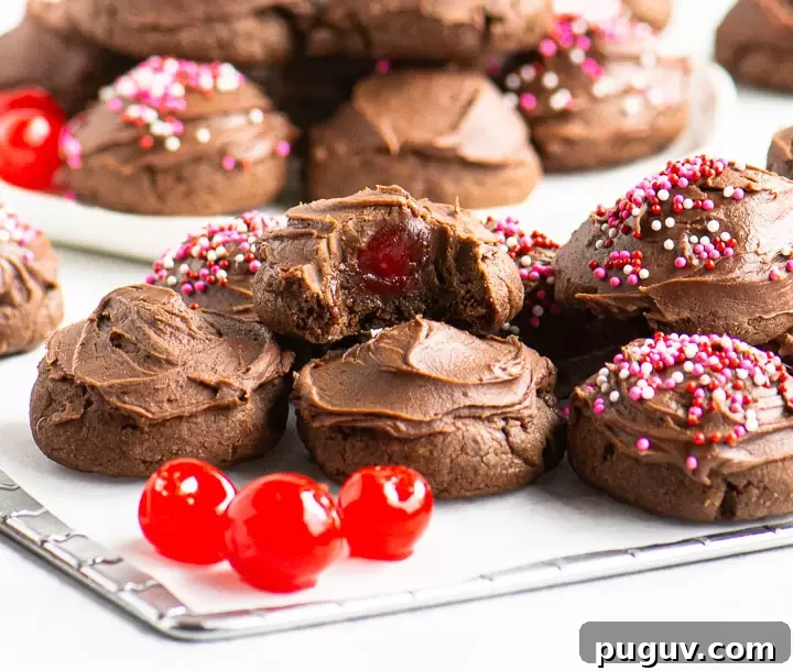 wire rack with cookies and maraschino cherries on top