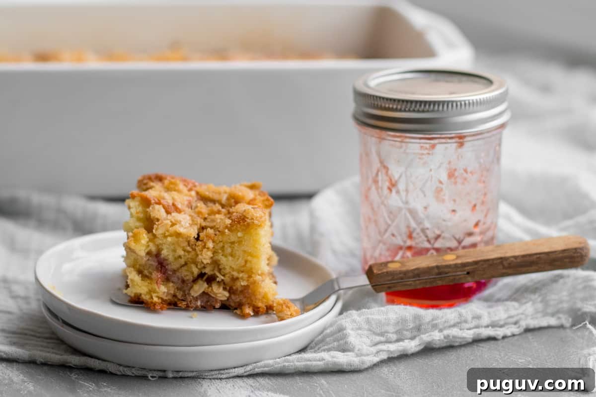 coffee cake on white plate with empty jam jar