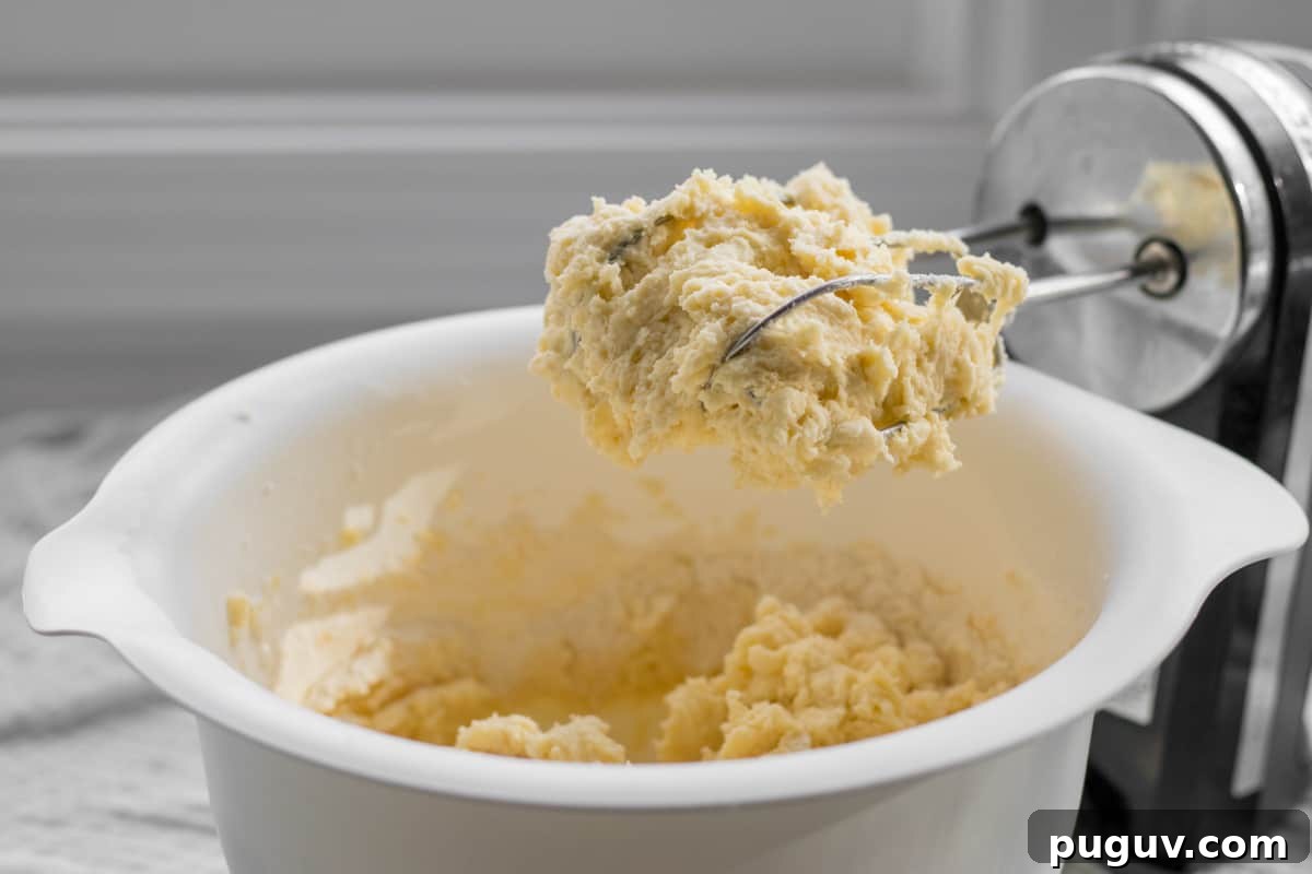 thick batter in a bowl with a hand mixer