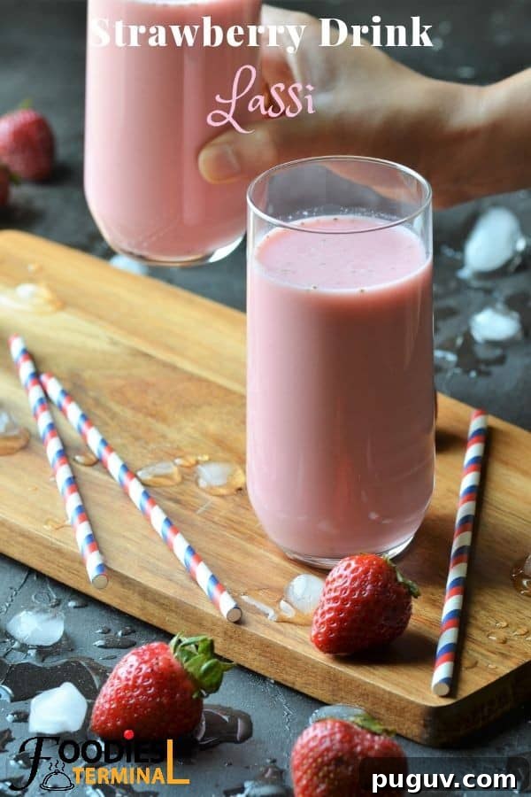 Refreshing Homemade Strawberry Lassi Recipe: Creamy Yogurt Drink 14 Strawberry Lassi in a glass with straws & berries by the side