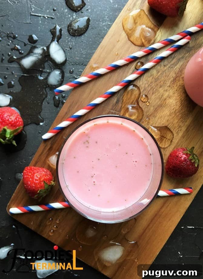 Refreshing Homemade Strawberry Lassi Recipe: Creamy Yogurt Drink 7 Homemade strawberry lassi recipe with berries by the side