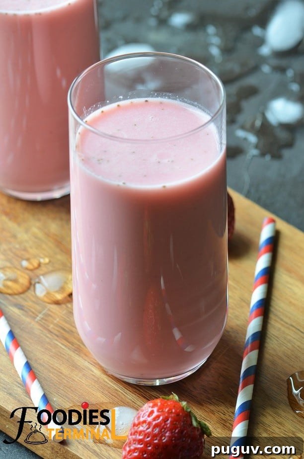 Refreshing Homemade Strawberry Lassi Recipe: Creamy Yogurt Drink 8 Strawberry Lassi Indian style in a tall glass