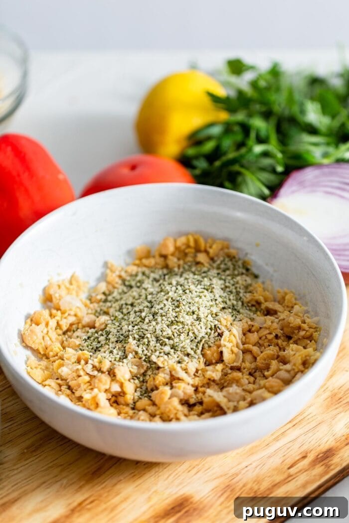 Chickpea Tabbouleh Salad with Fresh Herbs and Lemon Dressing 4 Hemp seeds and mashed chickpeas in a bowl.