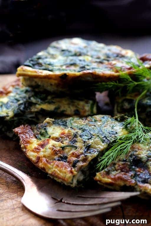 Spinach, Leek & Feta Frittata Recipe for Brunch or Dinner 6 Photo of pieces of frittata piled up on wood trivet.