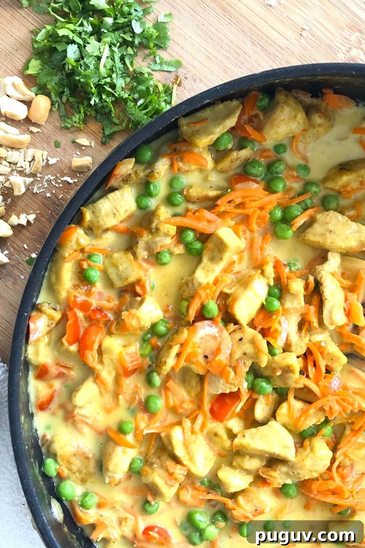 Authentic Thai Coconut Curry Chicken Recipe for Dinner 2 sauté pan with Thai chicken with peas.