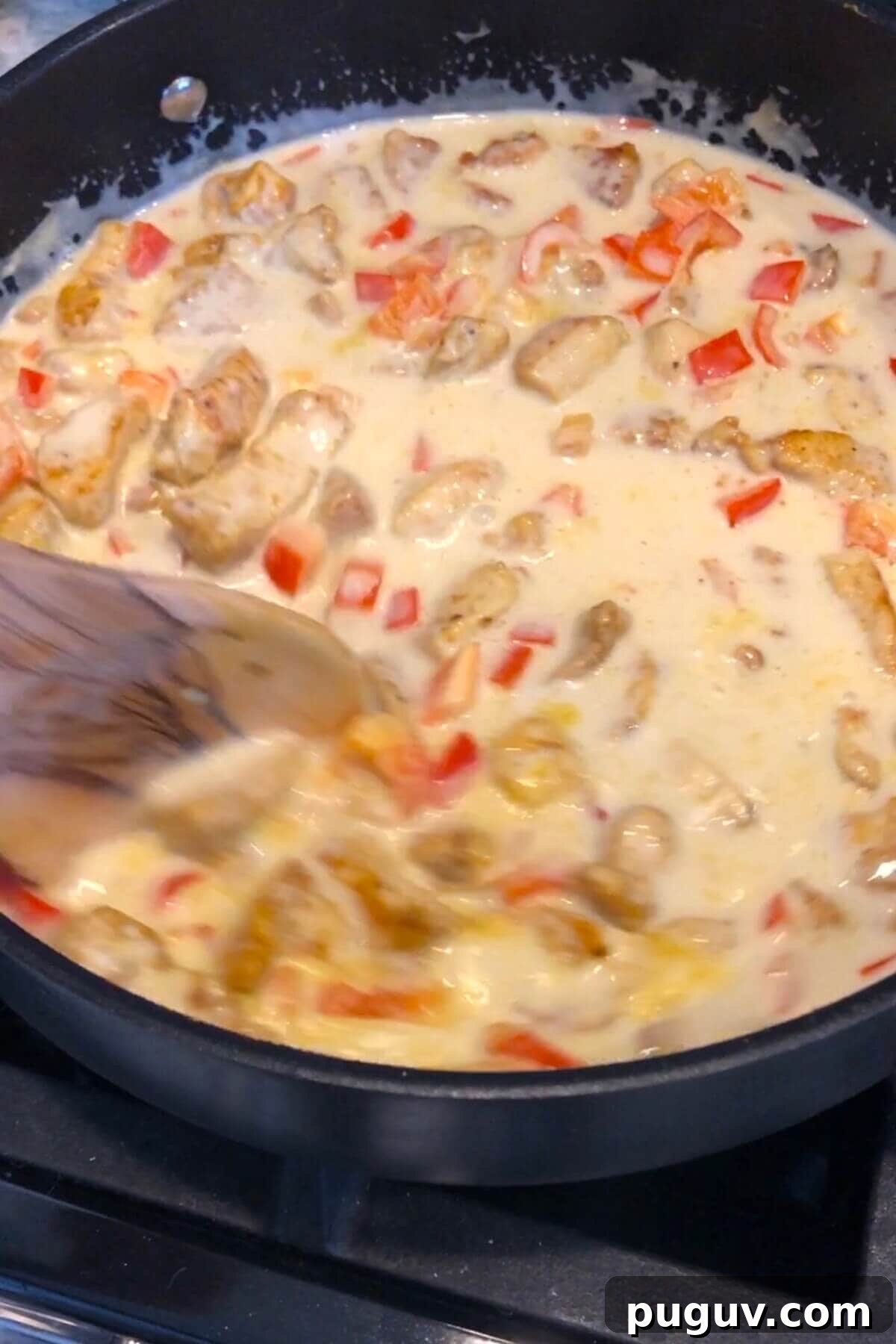 Authentic Thai Coconut Curry Chicken Recipe for Dinner 6 stirring coconut curry sauce.