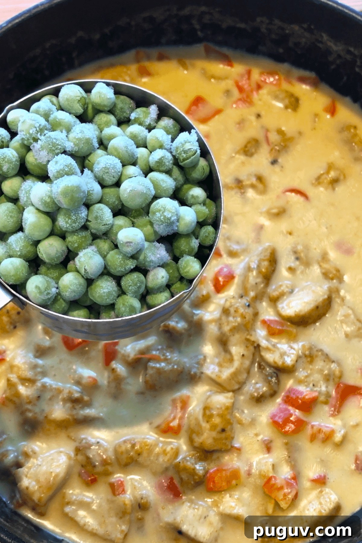 Authentic Thai Coconut Curry Chicken Recipe for Dinner 7 adding peas to Thai chicken recipe.