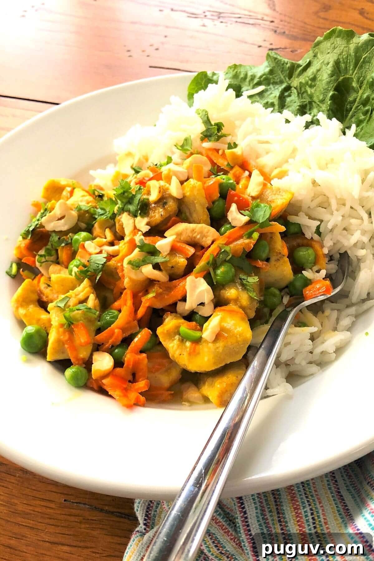 Authentic Thai Coconut Curry Chicken Recipe for Dinner 8 Thai chicken over jasmine rice in a bowl.
