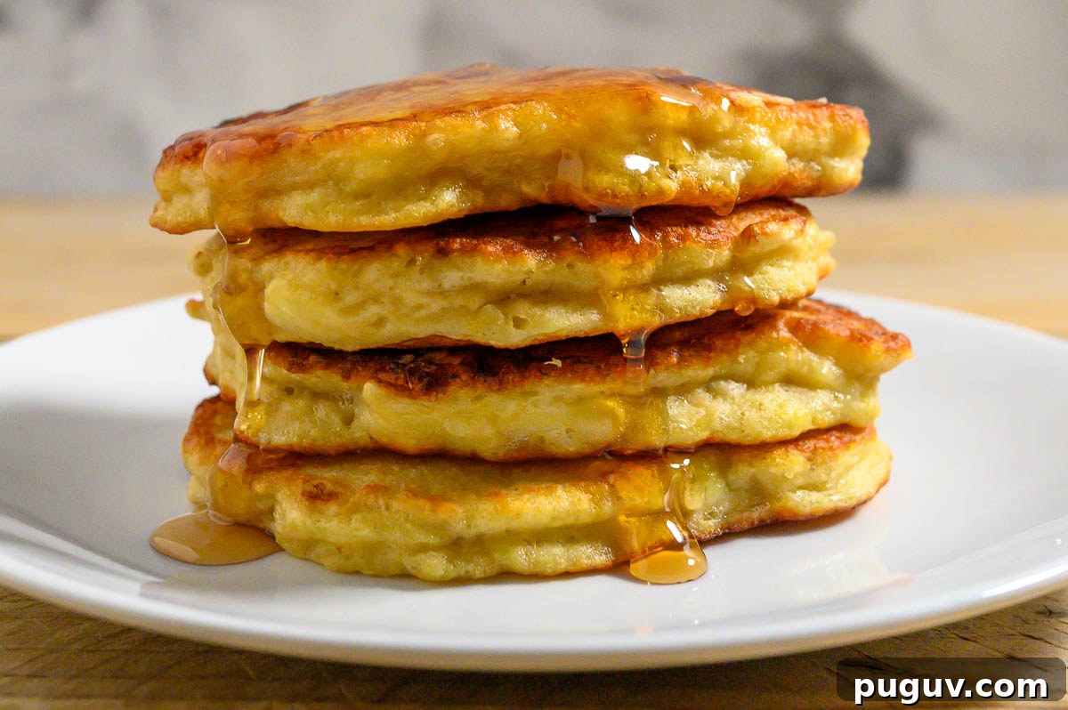 Banana Pancakes stacked on a plate.