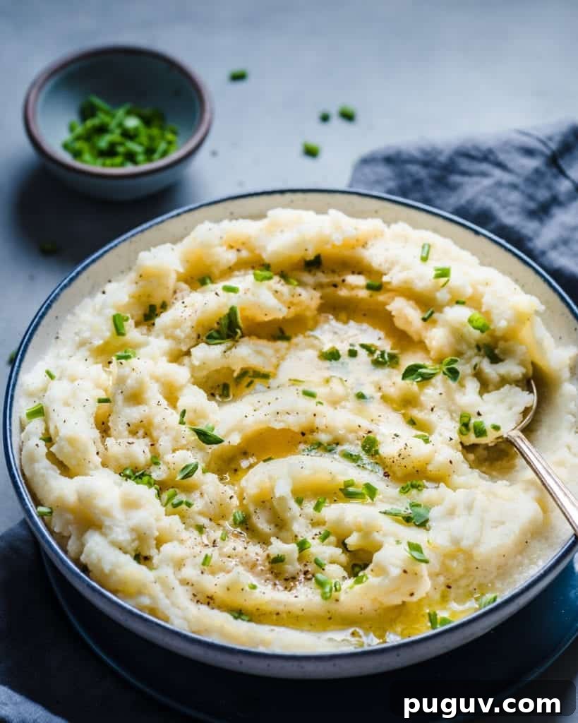 vegan mashed potatoes in a bowl with chives on top