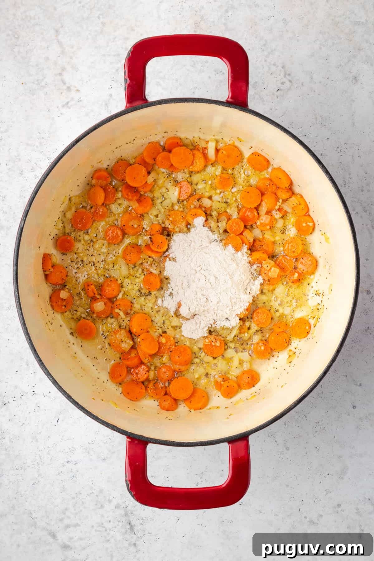 Gluten free flour being mixed into the cooked vegetables.