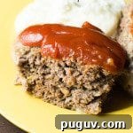 Easy Crock Pot Meatloaf: Are you looking for a wonderful meatloaf recipe? This easy crock pot recipe is one of my favorite ways to make meatloaf. These simple steps produce the delicious homemade favorite every time.