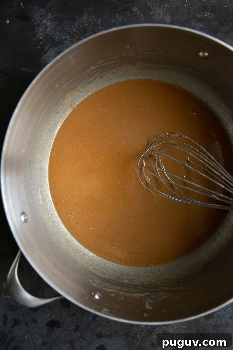 Dark gumbo roux in a large pot.