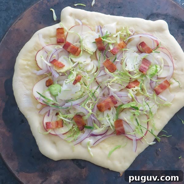 building pizza on a pizza stone.